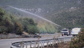 İzmir’de araçtaki alevlerin ormana sıçraması ile çıkan yangına müdahale sürüyor