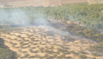 Kınık'ta ziraat arazisinde çıkan yangın ormana sıçradı: 4 uçak, 1 helikopter müdahale ediyor